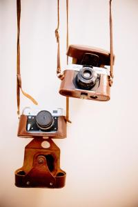 an old camera is hanging from a pole at The Lovers Suite in Cava deʼ Tirreni