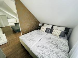 a bedroom with a bed in a room at Ferienwohnung Moments klimatisiert in Balingen +24 photos
