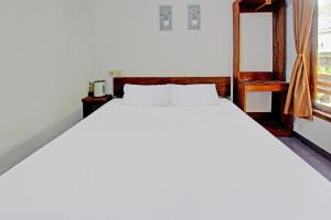 Postel nebo postele na pokoji v ubytování Tastura Homestay