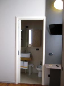 a bathroom with a sink and a toilet at Hotel Giglio in Salsomaggiore Terme
