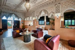 a lobby with couches and a table in a room at Dafa Splendide Riad Agadir résidentiel 8 or 9 Px in Agadir