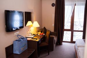 TV a/nebo společenská místnost v ubytování Romantik Spa Hotel