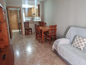 a living room with a table and chairs and a couch at San Ramón centro Benicarló in Benicarló +37 photos