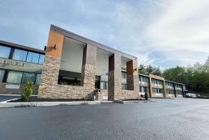 an empty parking lot in front of a building at Wingate by Wyndham Lake George in Lake George