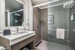 a bathroom with a sink and a shower at Hyatt House Sacramento-Midtown in Sacramento