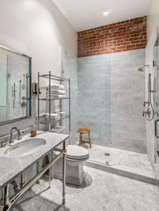 a bathroom with a sink and a toilet and a shower at Hyatt House Sacramento-Midtown in Sacramento