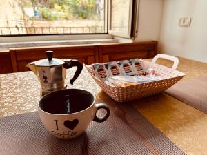 a coffee cup and a basket on a table at Terra mia in Naples