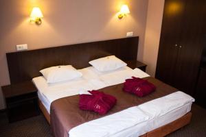 Postel nebo postele na pokoji v ubytování Romantik Spa Hotel