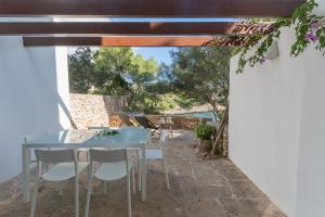 a blue table and chairs on a patio at Apartamento Ferrera Park 103 in Cala d´Or