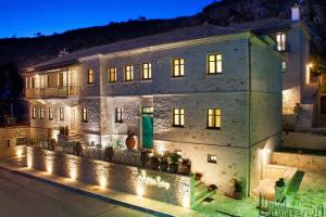 a building with lights in front of it at night at Haones Suites in Ioannina