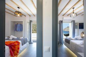 two views of a bedroom with two beds at Droufakos’ home, Lux seafront apartment w. View in Sifnos