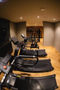 a row of exercise bikes in a gym at Studio Boutique in Porto Alegre
