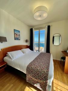 Postel nebo postele na pokoji v ubytování Hôtel Posta Vecchia