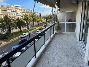 a balcony of a building with a view of a street at Alex Apartment in Athens