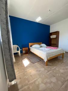 Un pat sau paturi într-o cameră la Casa Ze & sonia