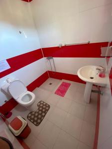 a bathroom with a toilet and a sink at Casa Ze & sonia in Portela
