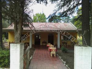 an entrance to a house with a brick walkway at Posada Tanti El Durazno in Tanti +17 photos