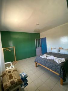 Un pat sau paturi într-o cameră la Casa Ze & sonia