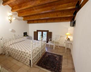 Postel nebo postele na pokoji v ubytování Villa Scalabrini