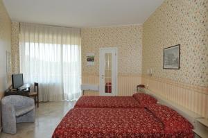 Rúm í herbergi á Hotel Fossati
