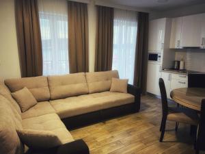 a living room with a couch and a table at Tisno Resort in Tisno