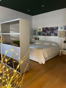 a bedroom with a bed with lights on it at Garden house in Rome