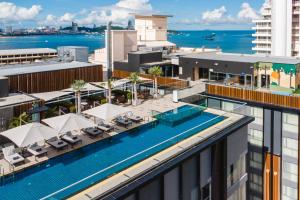 an aerial view of the rooftop of a building with a swimming pool at Courtyard by Marriott North Pattaya in Pattaya North
