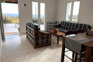 a living room with a couch and a table at Haus Granes in Finikounta