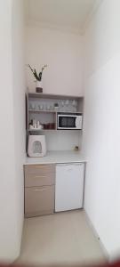 Kuchyň nebo kuchyňský kout v ubytování Regina's place