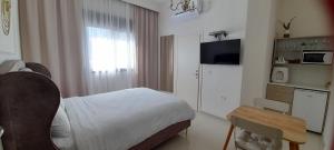 Kuchyň nebo kuchyňský kout v ubytování Regina's place