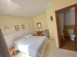 Postel nebo postele na pokoji v ubytování Hotel Cabello