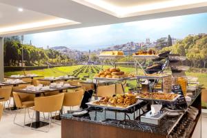 a buffet at a hotel with a view of the city at Empire Marquês Hotel in Lisbon