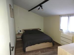 Posteľ alebo postele v izbe v ubytovaní le chalet de vaucroix
