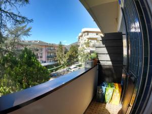 a balcony with a view of a city at La Dimora del Piccolo Buddha in Rapallo