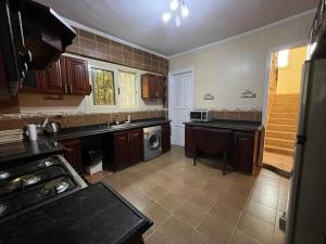a kitchen with a sink and a dishwasher at Elegant Villa with Private Pool in Alexandria