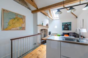 a kitchen and living room with a map on the wall at The Brew House in Bath