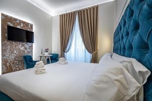 A bed or beds in a room at Residenza Giotto Még 37 kép