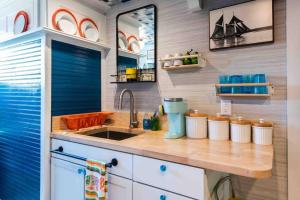 a kitchen with a sink and a counter top at Stylish Old Louisville 1 Bedroom Apartment in Louisville