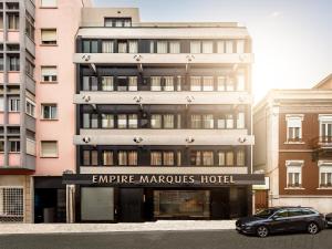 a car parked in front of a building at Empire Marquês Hotel in Lisbon