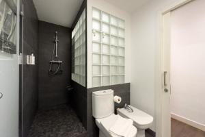 a bathroom with a toilet and a sink at Key Sagrada Família & Park Guell Apartment in Barcelona