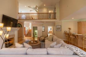 a living room with a couch and a fireplace at Mountain Gem in Boone