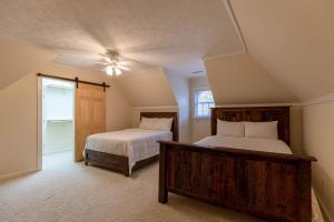 a bedroom with two beds and a window at Mountain Gem in Boone