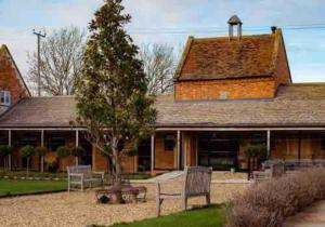 a house with a tree in front of it at Dovecote in Chipping Campden