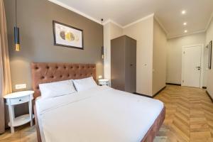 Posteľ alebo postele v izbe v ubytovaní Design Apartment on Mykhailivskyi Ln. 4