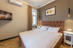Posteľ alebo postele v izbe v ubytovaní Design Apartment on Mykhailivskyi Ln. 4