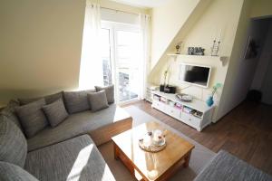 TV a/nebo společenská místnost v ubytování Ferienwohnung Sonne&Meer