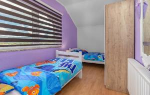 En eller flere senge i et værelse på Apartments Sweet Home