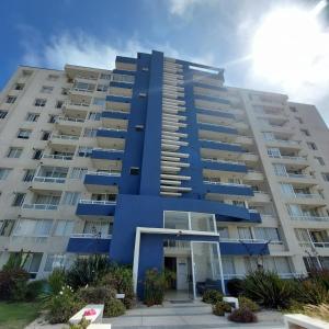 a blue apartment building with a blue at Departamento vista al mar in La Serena