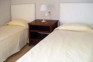 A bed or beds in a room at Par 4 Villa 7
