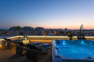 a hot tub on the roof of a building at Zadar Sunset Penthouse with spectacular view and jacuzzi in Zadar